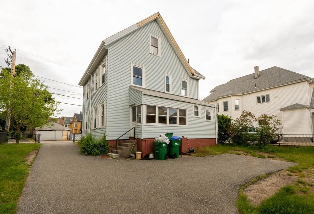 175 Riverside Avenue Medford, MA 02155 - Photo 35 of 38 a front view of a house with a yard and garage