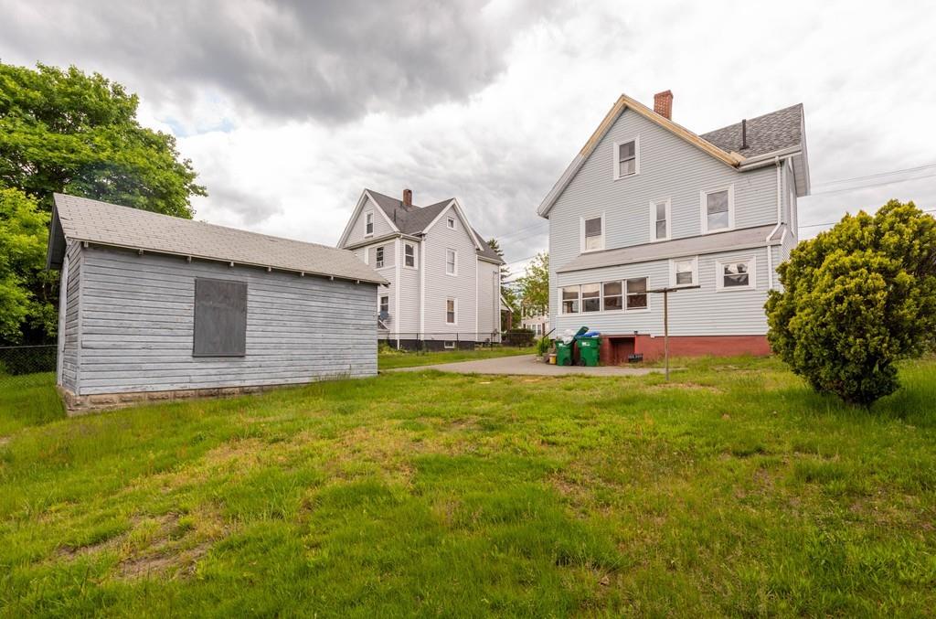 175 Riverside Avenue Medford, MA 02155 - Photo 38 of 38 a front view of house with yard and garage