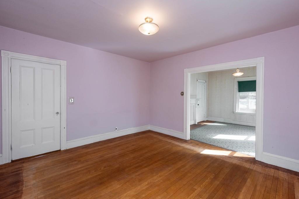 175 Riverside Avenue Medford, MA 02155 - Photo 10 of 38 a view of empty room with wooden floor and fan