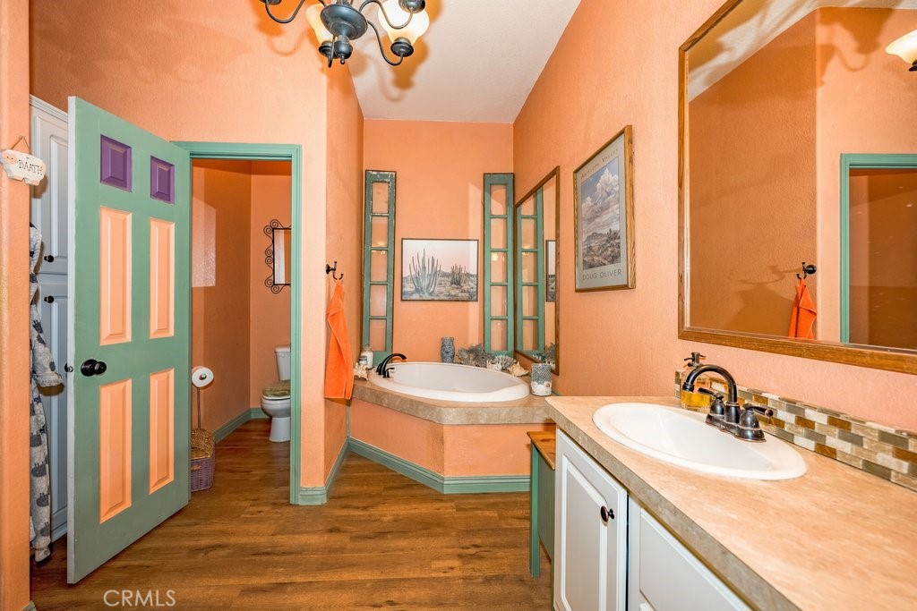 33330 Palen Road Agua Dulce, CA 91390 - Photo 19 of 56 a bathroom with a double vanity sink and a mirror