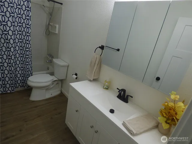 a bathroom with a sink and mirror