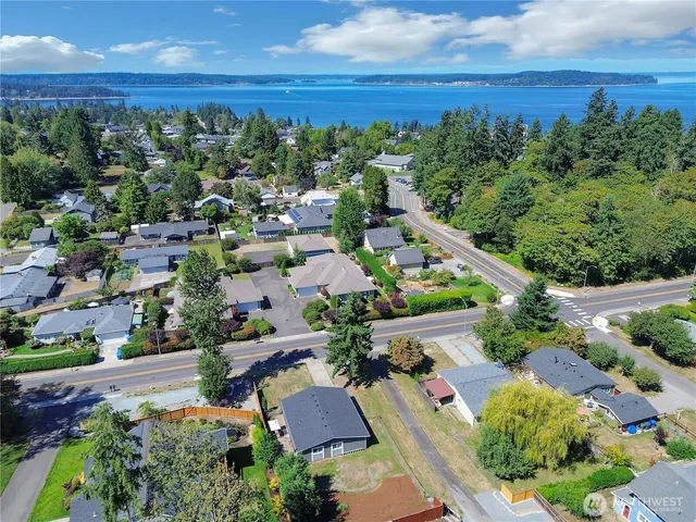 an aerial view of a houses with a yard