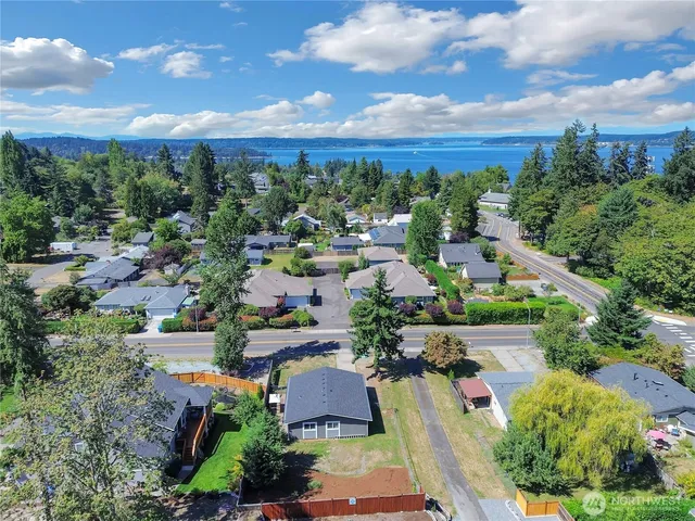 an aerial view of a house with a yard