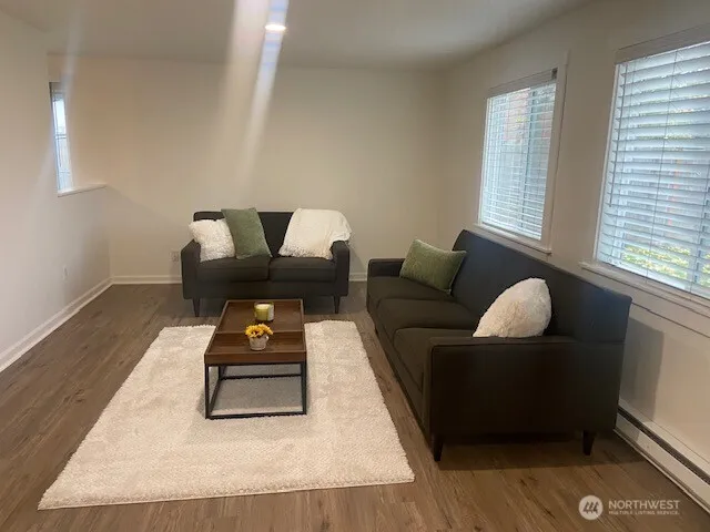 a living room with furniture and window