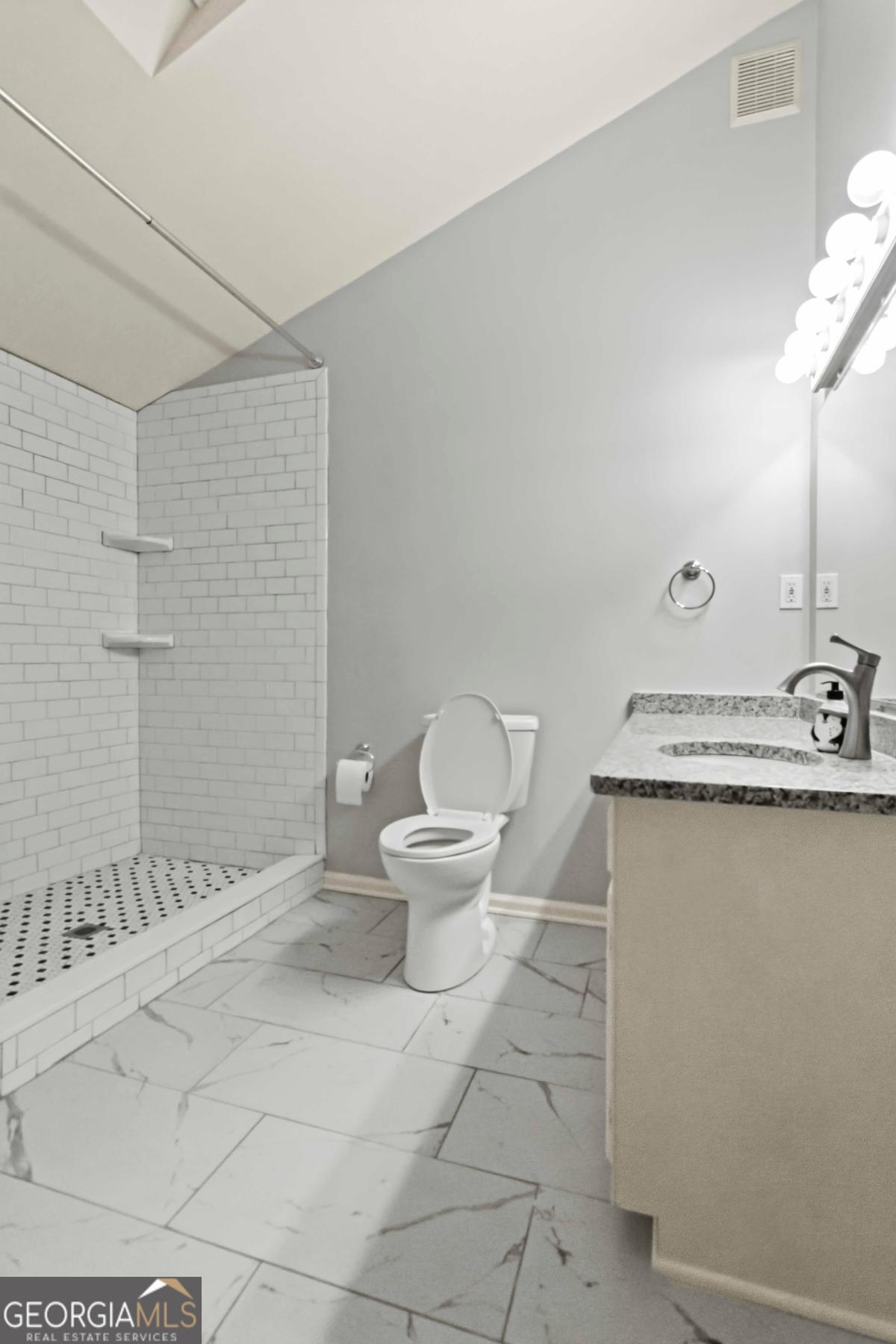 2312 Wayside Drive Brookhaven, GA 30319 - Photo 14 of 18 a bathroom with a sink toilet and shower