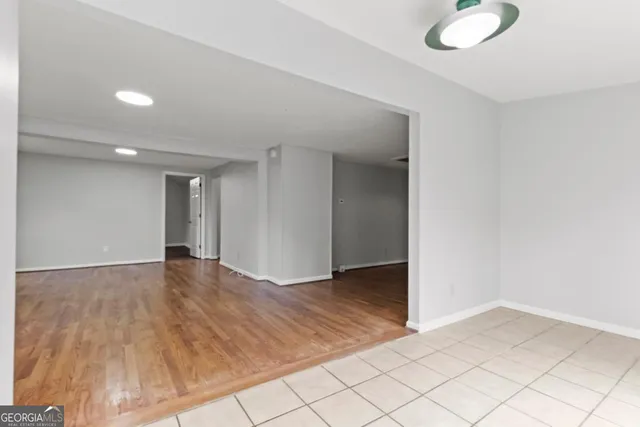 an empty room with wooden floor