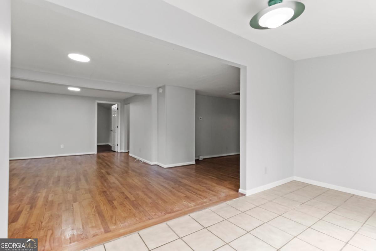 2312 Wayside Drive Brookhaven, GA 30319 - Photo 4 of 18 an empty room with wooden floor