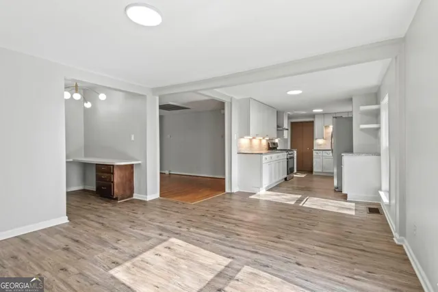 a view of a room with rack and wooden floor