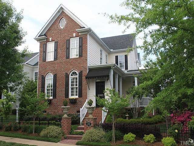 10323 Evergreen Spring Place Raleigh, NC 27614 - Photo 1 of 12 Beautiful Charleston style home with brick front. Attractive awning and window boxes and exceptional landsaping as well as fence enhance street appeal. Houses are separated from across the streets with wide grassy median.