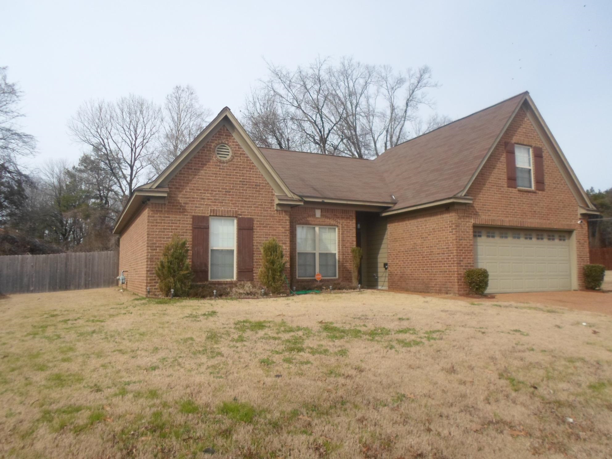 5959 Matthew Drive Horn Lake, MS 38637 - Photo 1 of 24 a front view of a house with a yard
