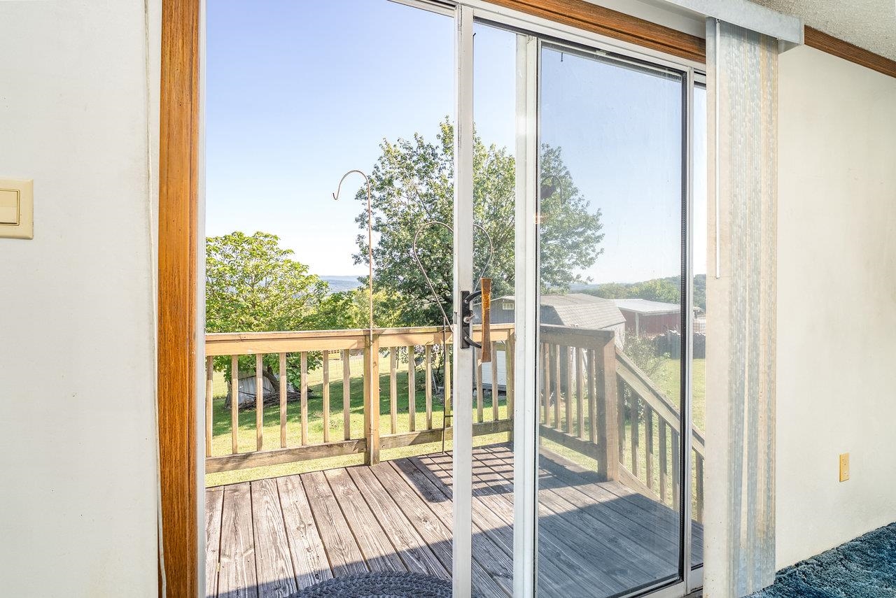 9072 Shultztown Road Linville, VA 22834 - Photo 11 of 51 a view of a room with wooden floor and a porch