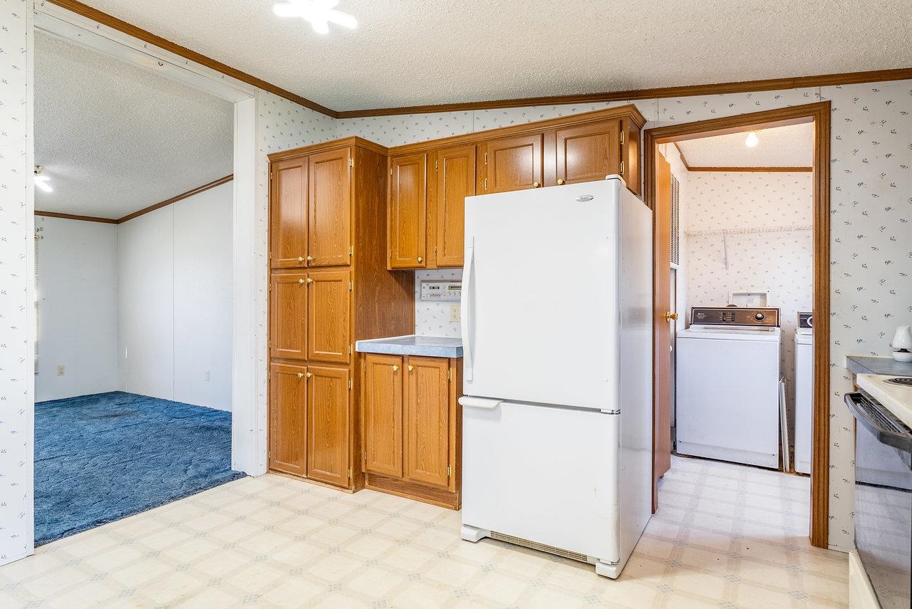 9072 Shultztown Road Linville, VA 22834 - Photo 17 of 51 a white refrigerator freezer and a dishwasher in a kitchen