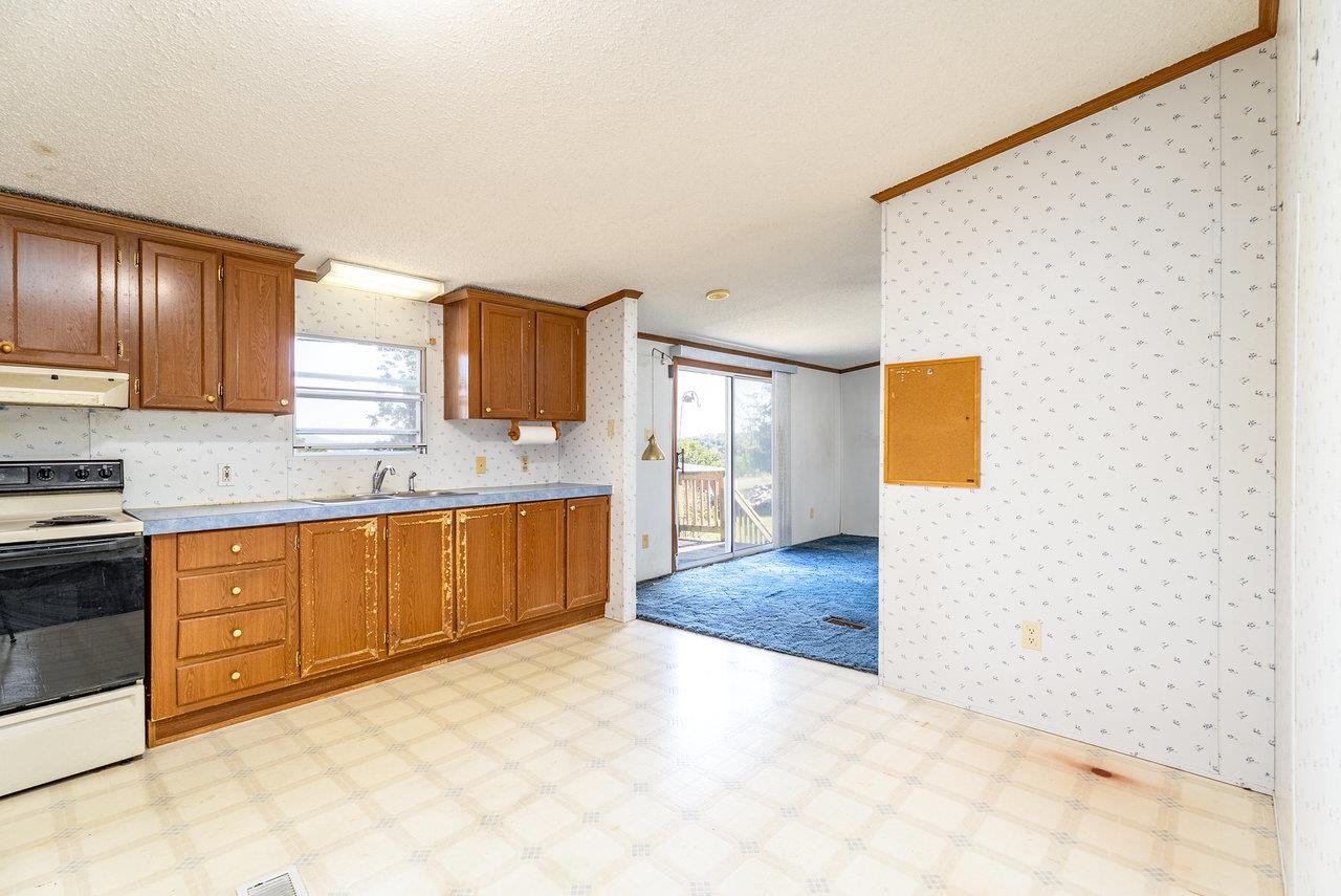 9072 Shultztown Road Linville, VA 22834 - Photo 18 of 51 a large bathroom with a granite countertop sink and a mirror