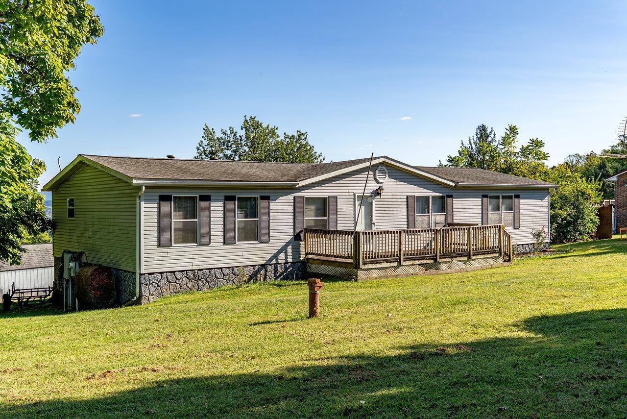 9072 Shultztown Road Linville, VA 22834 - Photo 2 of 51 a view of a house with a yard patio and swimming pool