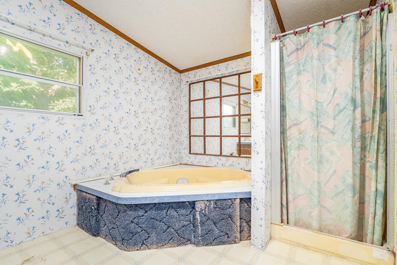 9072 Shultztown Road Linville, VA 22834 - Photo 24 of 51 a bathroom with a tub and shower