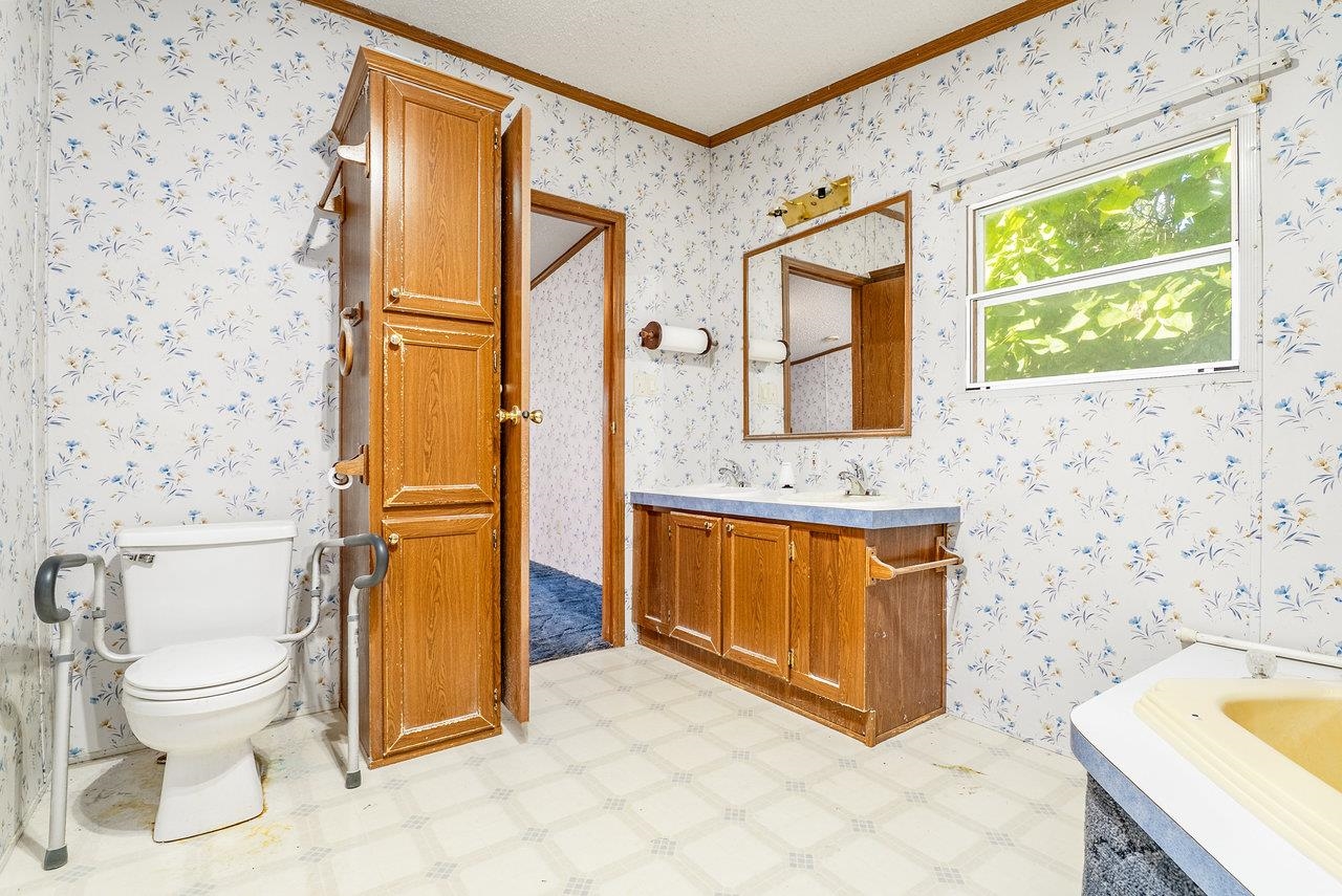 9072 Shultztown Road Linville, VA 22834 - Photo 25 of 51 a spacious bathroom with a granite countertop sink toilet and shower