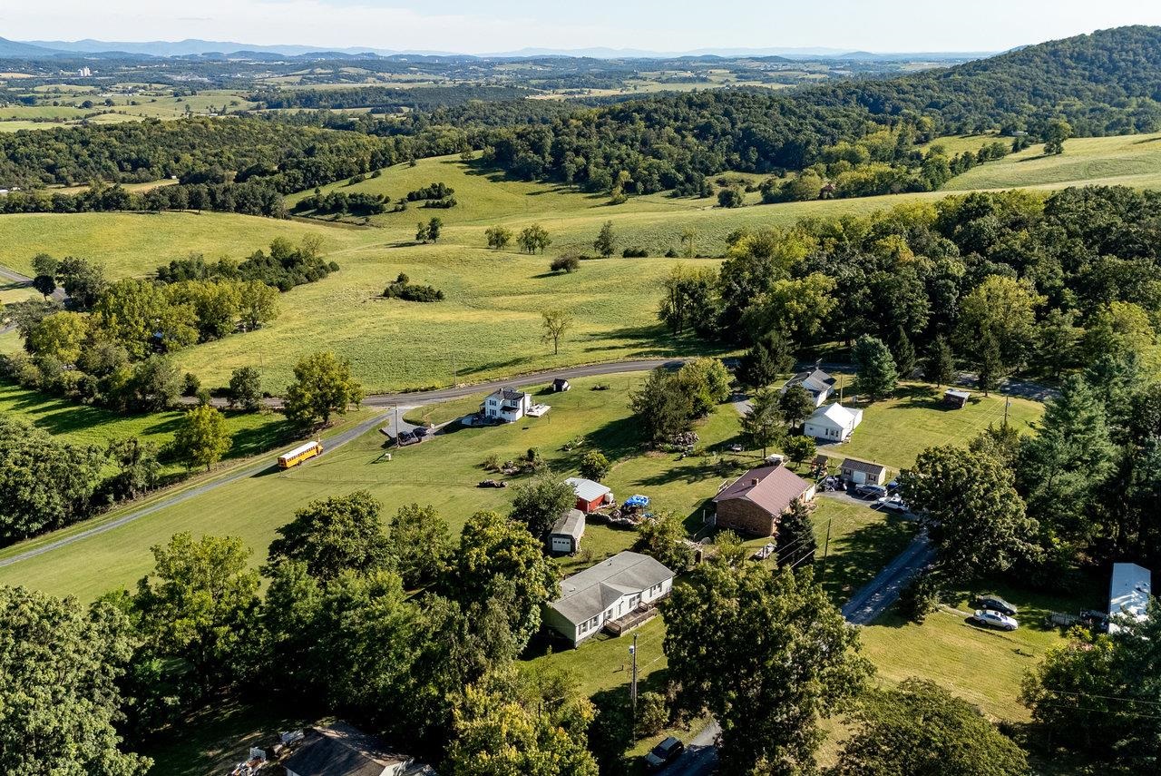 9072 Shultztown Road Linville, VA 22834 - Photo 38 of 51 an aerial view of residential houses with outdoor space and trees