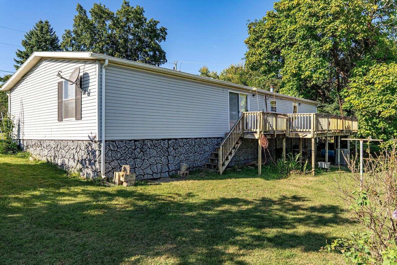 9072 Shultztown Road Linville, VA 22834 - Photo 48 of 51 a backyard of a house with table and chairs