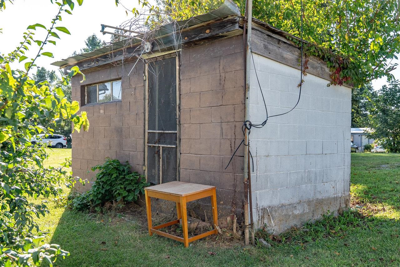 9072 Shultztown Road Linville, VA 22834 - Photo 51 of 51 a backyard of a house with table and chairs plants