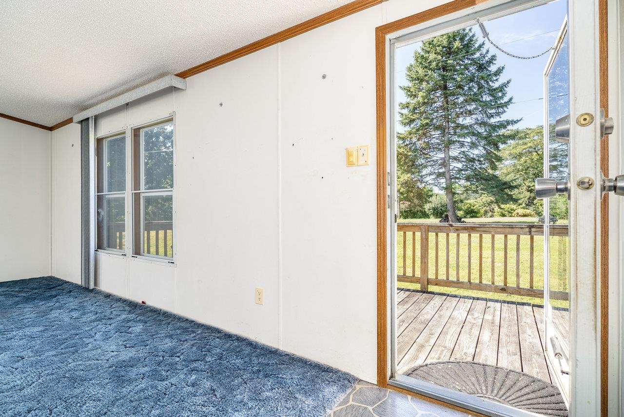 9072 Shultztown Road Linville, VA 22834 - Photo 6 of 51 a view of an empty room with wooden floor and a window