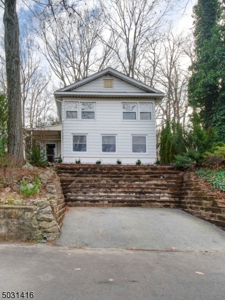 32 Cliffside Trail Denville, NJ 07834 - Photo 1 of 24 a front view of a house with a yard
