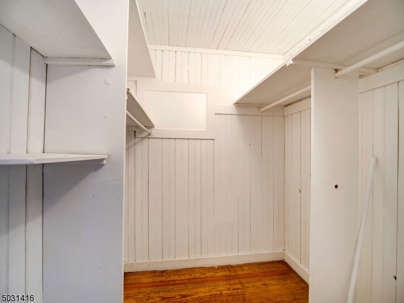 32 Cliffside Trail Denville, NJ 07834 - Photo 18 of 24 a view of walk in closet with empty racks