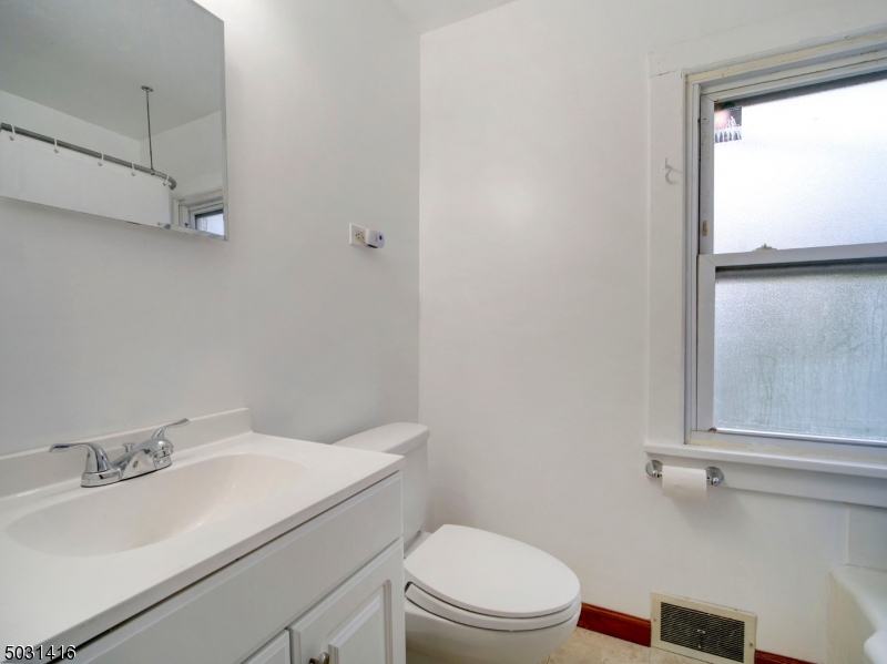 32 Cliffside Trail Denville, NJ 07834 - Photo 19 of 24 a bathroom with a sink a toilet and shower