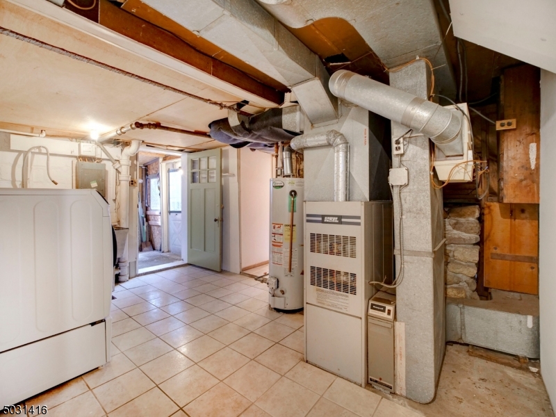 32 Cliffside Trail Denville, NJ 07834 - Photo 22 of 24 a view of a refrigerator and an empty room