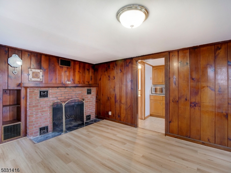 32 Cliffside Trail Denville, NJ 07834 - Photo 5 of 24 an empty room with kitchen fireplace and bathroom