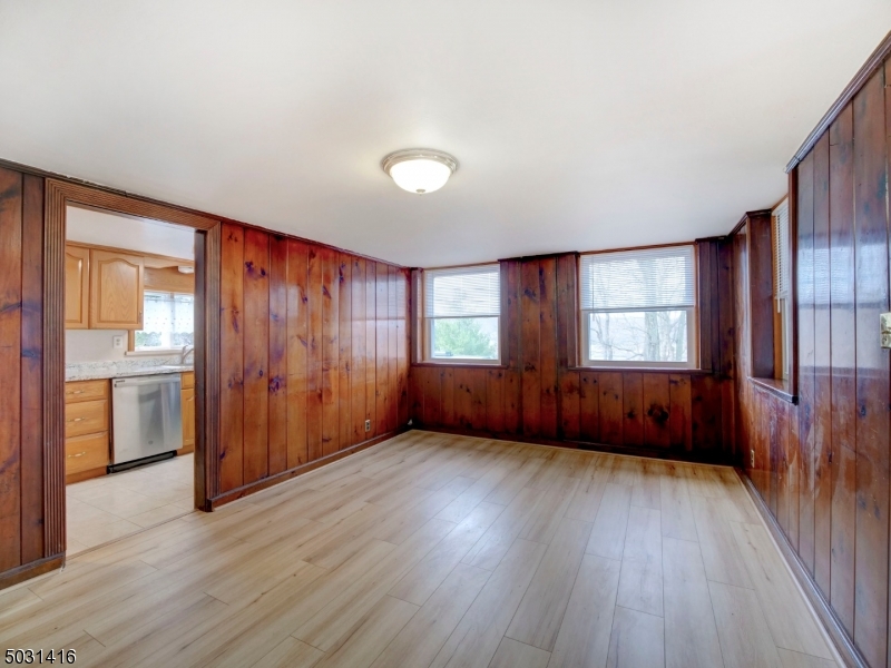 32 Cliffside Trail Denville, NJ 07834 - Photo 6 of 24 an empty room with wooden floor and windows