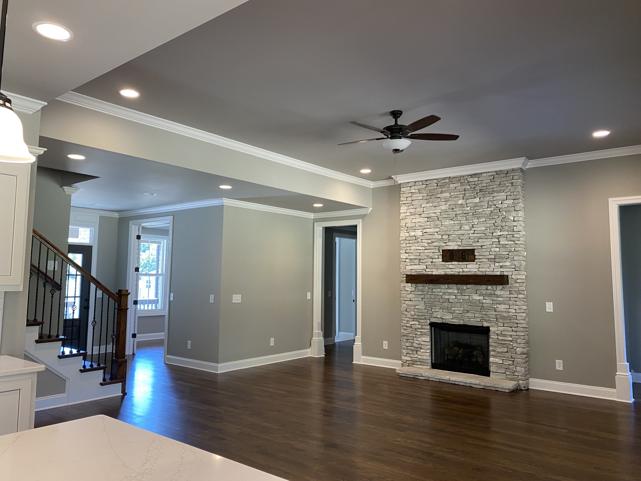 1075 Hideaway Road Columbia, TN 38401 - Photo 3 of 12 a view of a livingroom with a fireplace a ceiling fan and wooden floor