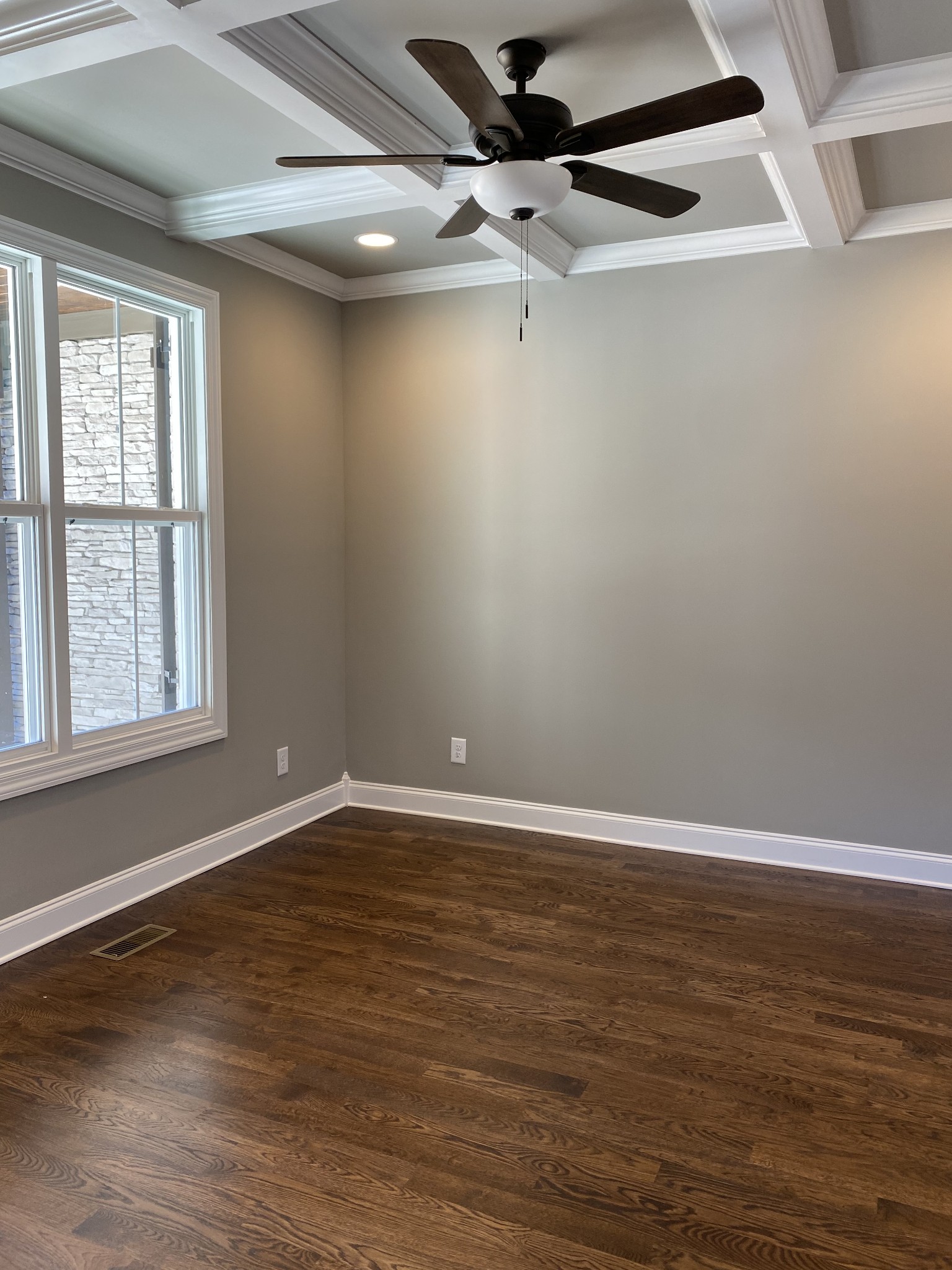1075 Hideaway Road Columbia, TN 38401 - Photo 7 of 12 a view of an empty room with wooden floor and a window