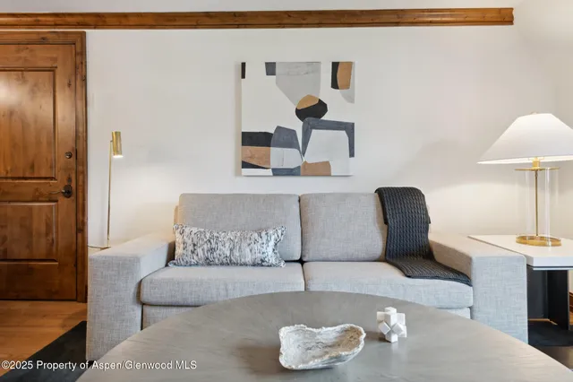 a living room with furniture and a table