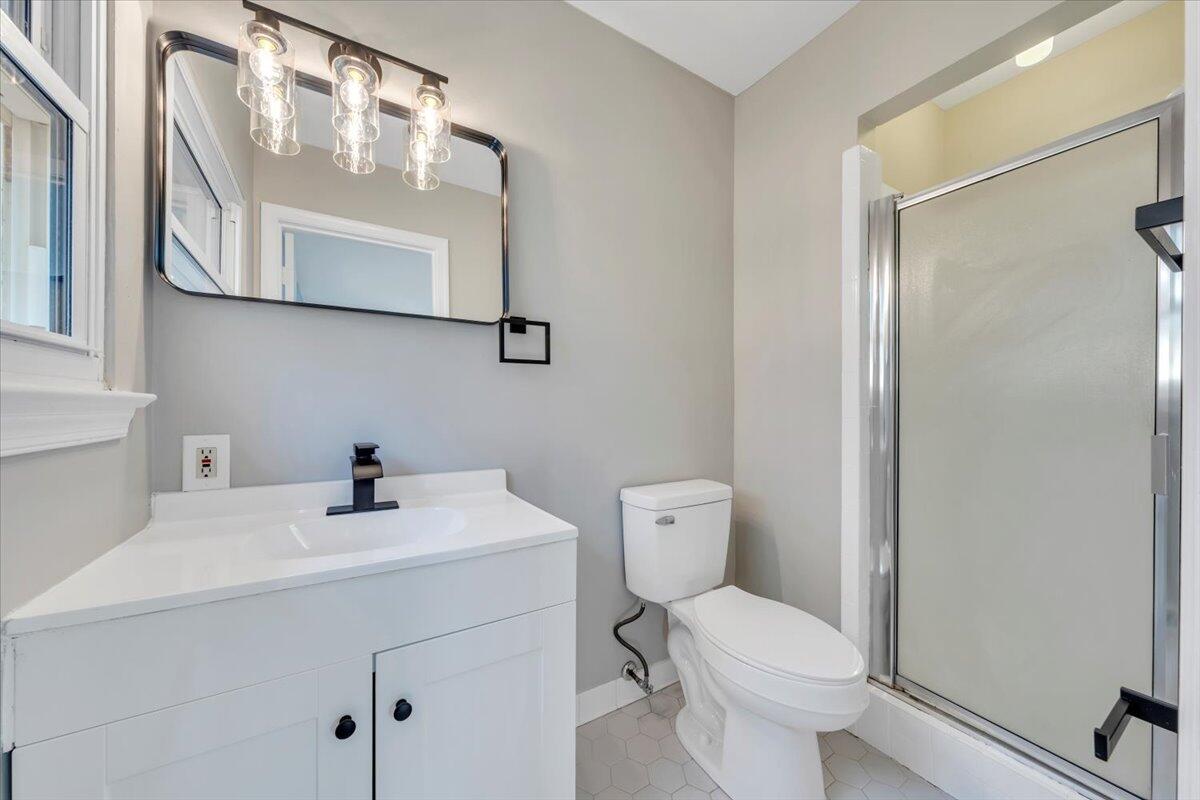 222 Maple Drive Blue Ridge, VA 24064 - Photo 18 of 24 a bathroom with a sink a toilet and a mirror