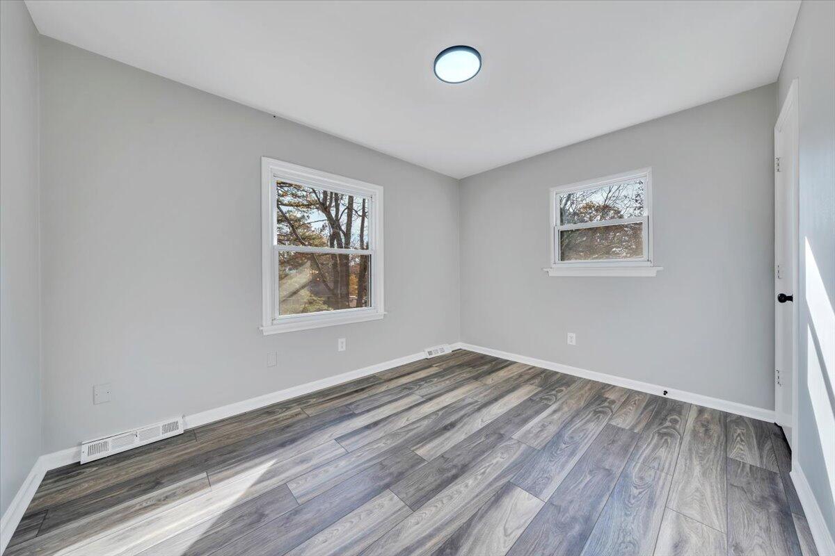 222 Maple Drive Blue Ridge, VA 24064 - Photo 19 of 24 a view of room with window and wooden floor
