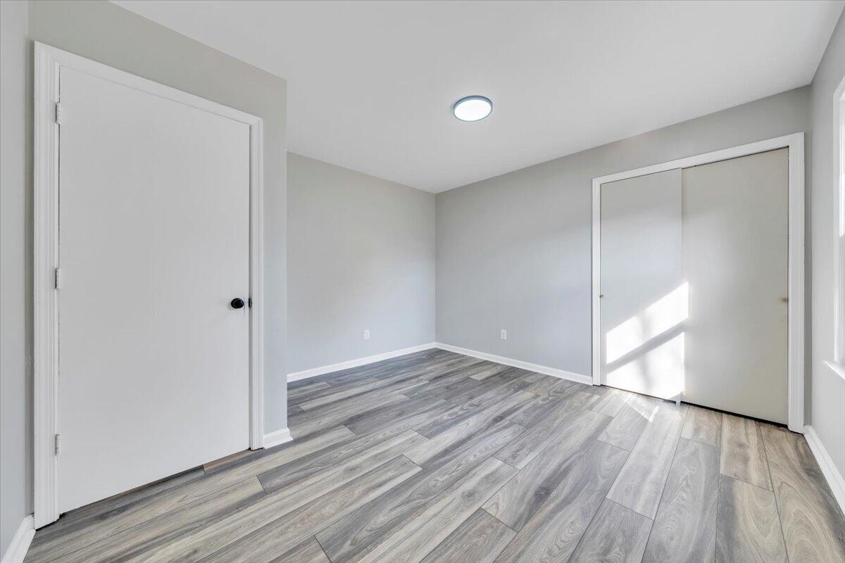 222 Maple Drive Blue Ridge, VA 24064 - Photo 20 of 24 a view of an empty room and wooden floor