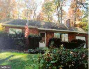 655 East Elizabethtown Road Manheim, PA 17545 - Photo 1 of 1 a view of a house with brick walls and a yard