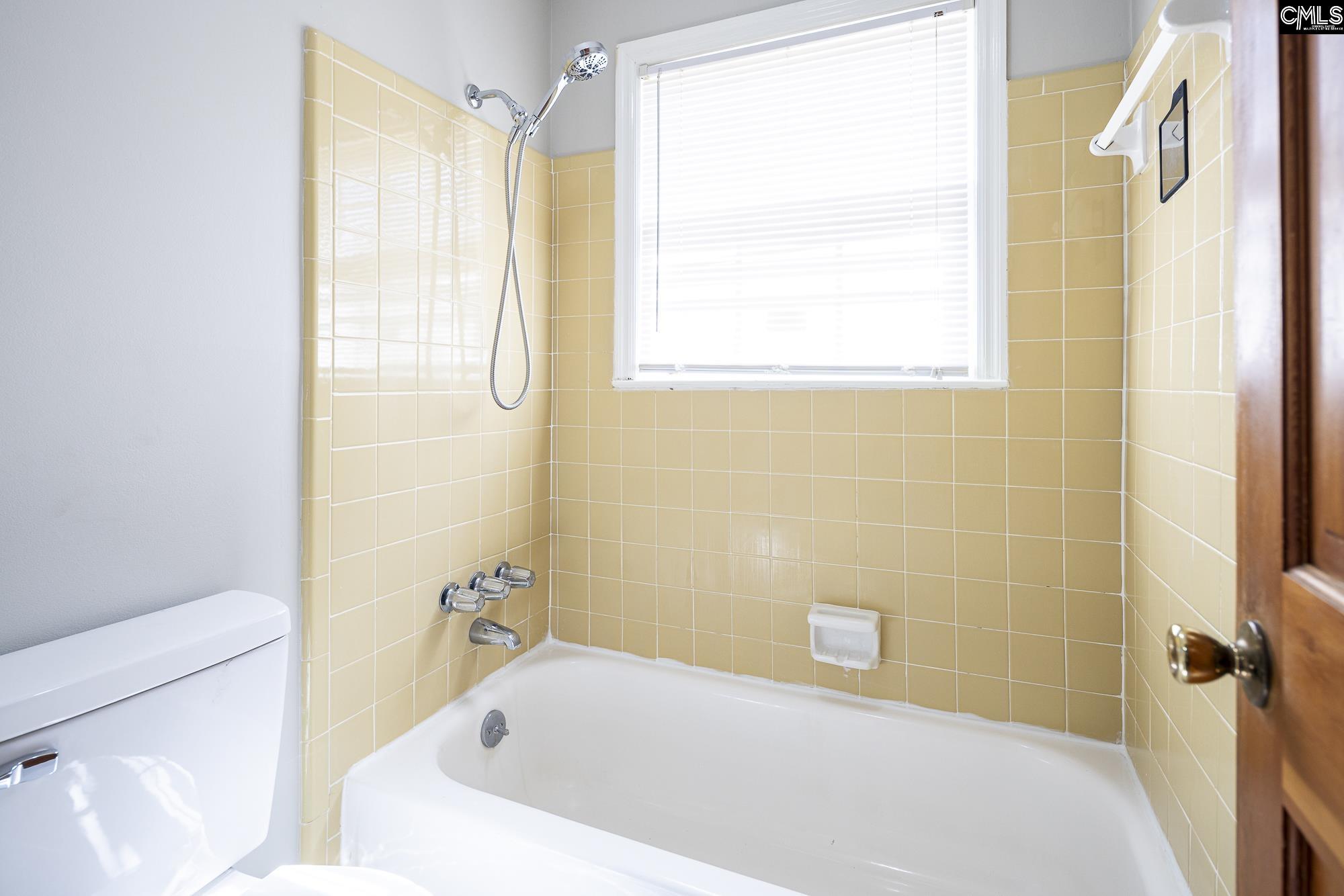 4083 Platt Springs Road West Columbia, SC 29170 - Photo 25 of 35 a bathroom with a bathtub and a shower