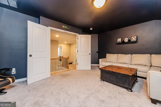 a spacious bedroom with a bed and a couch