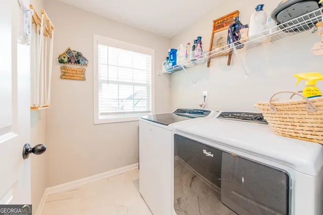 a utility room with a window dryer and washer