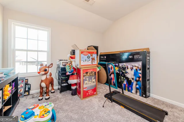 a children room with toys and ceiling fan
