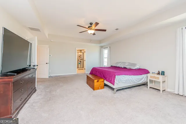 a room with a window and a chair