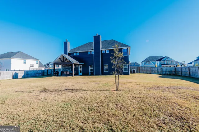 a balcony with furniture and a floor to ceiling window