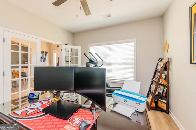 a bedroom with furniture and a flat screen tv
