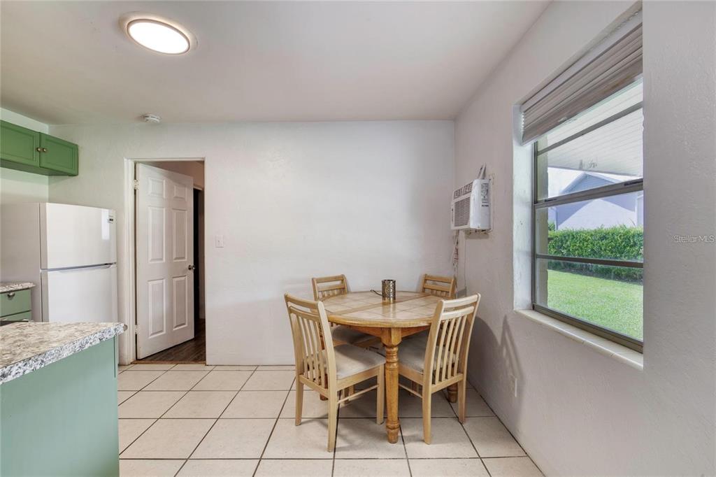 815 8th Street Daytona Beach, FL 32117 - Photo 13 of 50 a dining room with furniture and a window