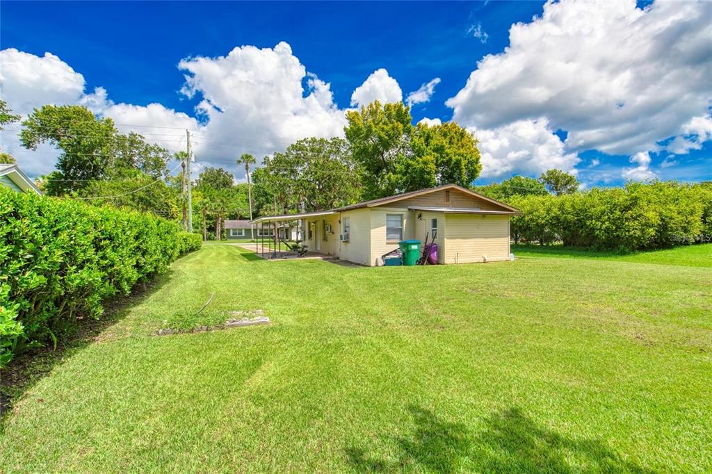 815 8th Street Daytona Beach, FL 32117 - Photo 36 of 50 a view of a house with backyard and a garden