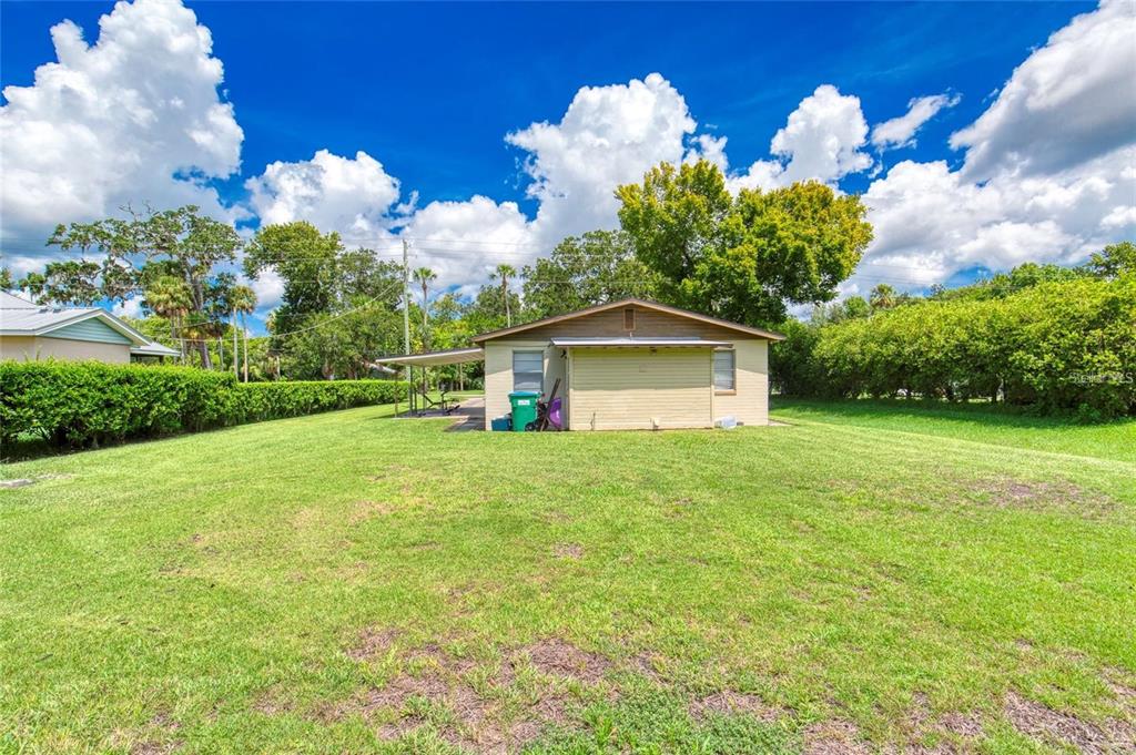 815 8th Street Daytona Beach, FL 32117 - Photo 39 of 50 a front view of a house with garden