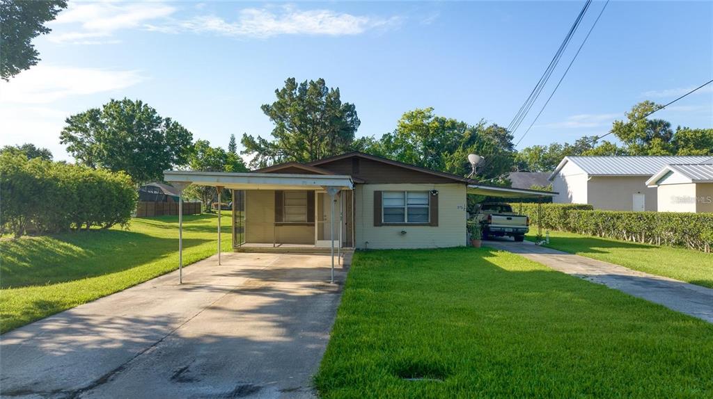 815 8th Street Daytona Beach, FL 32117 - Photo 42 of 50 a front view of a house with a garden