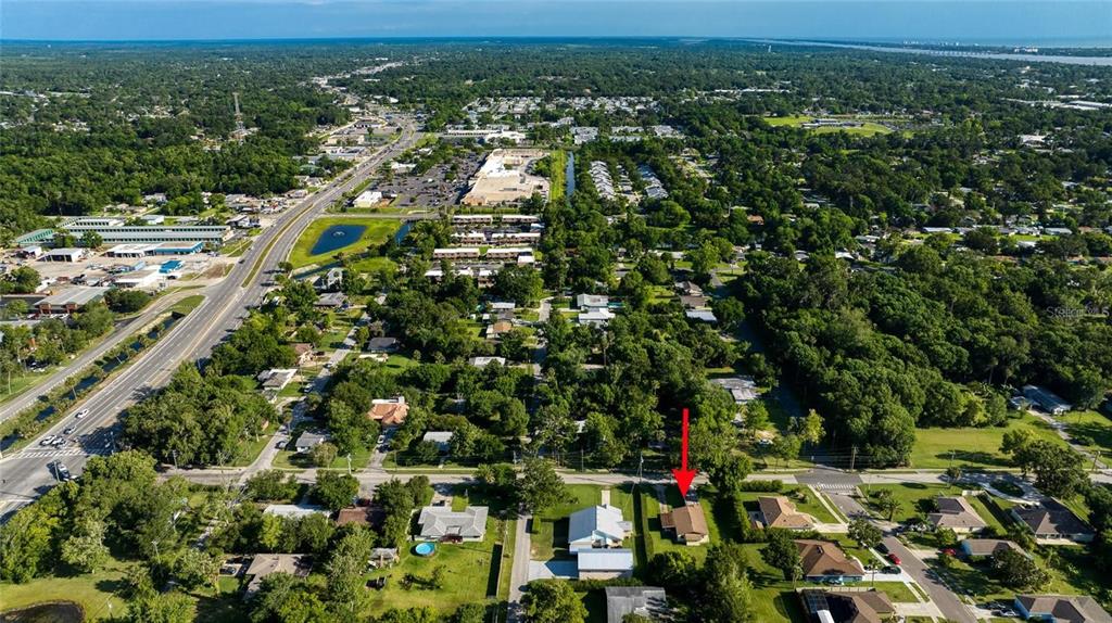 815 8th Street Daytona Beach, FL 32117 - Photo 48 of 50 an aerial view of residential houses with outdoor space and trees