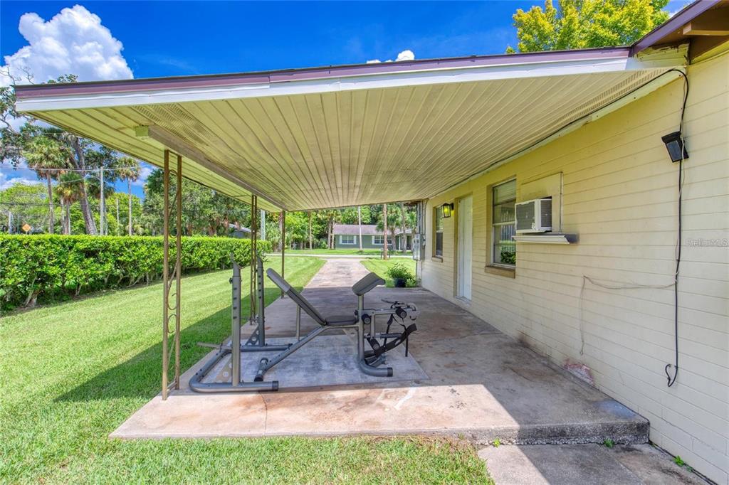 815 8th Street Daytona Beach, FL 32117 - Photo 6 of 50 a view of a patio with a table and chairs